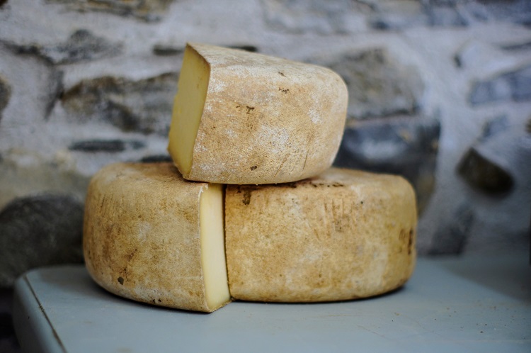 A stack of wheels of artisan cheese from Portugal
