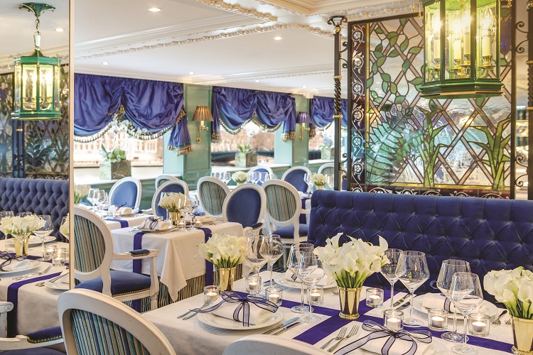 The elegant decor in the Cézanne Restaurant on-board Uniworld SS Catherine