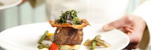 A gourmet steak dish in a restaurant on-board a Scenic river cruise ship