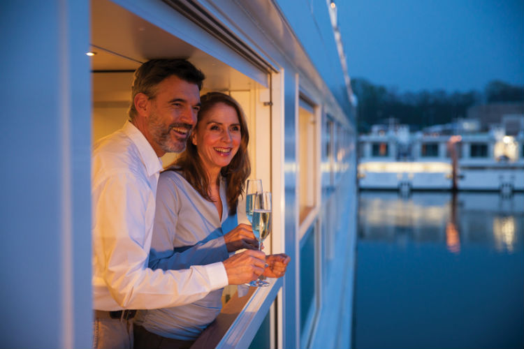 Couple on the balcony for Emerald Waterways